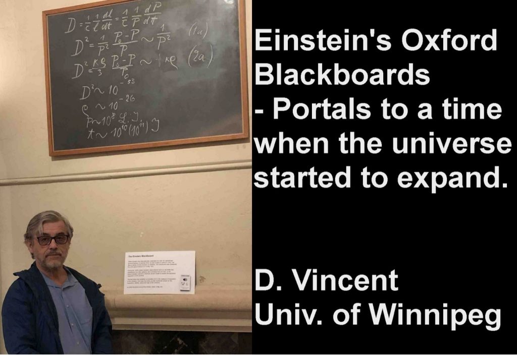 A man stands in front of a blackboard with calculations written on it